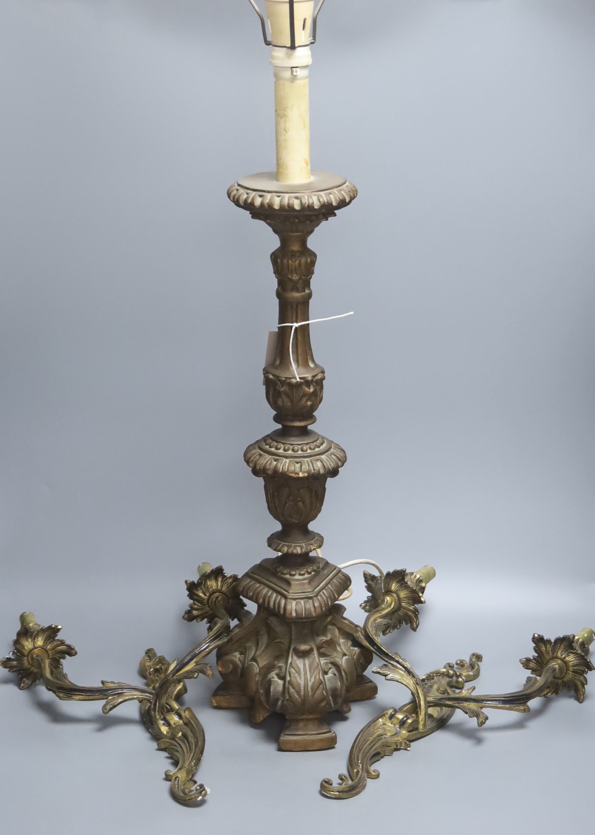 A pair of rococo style twin light wall sconces, and an Italian period style giltwood table lamp, height 56cm